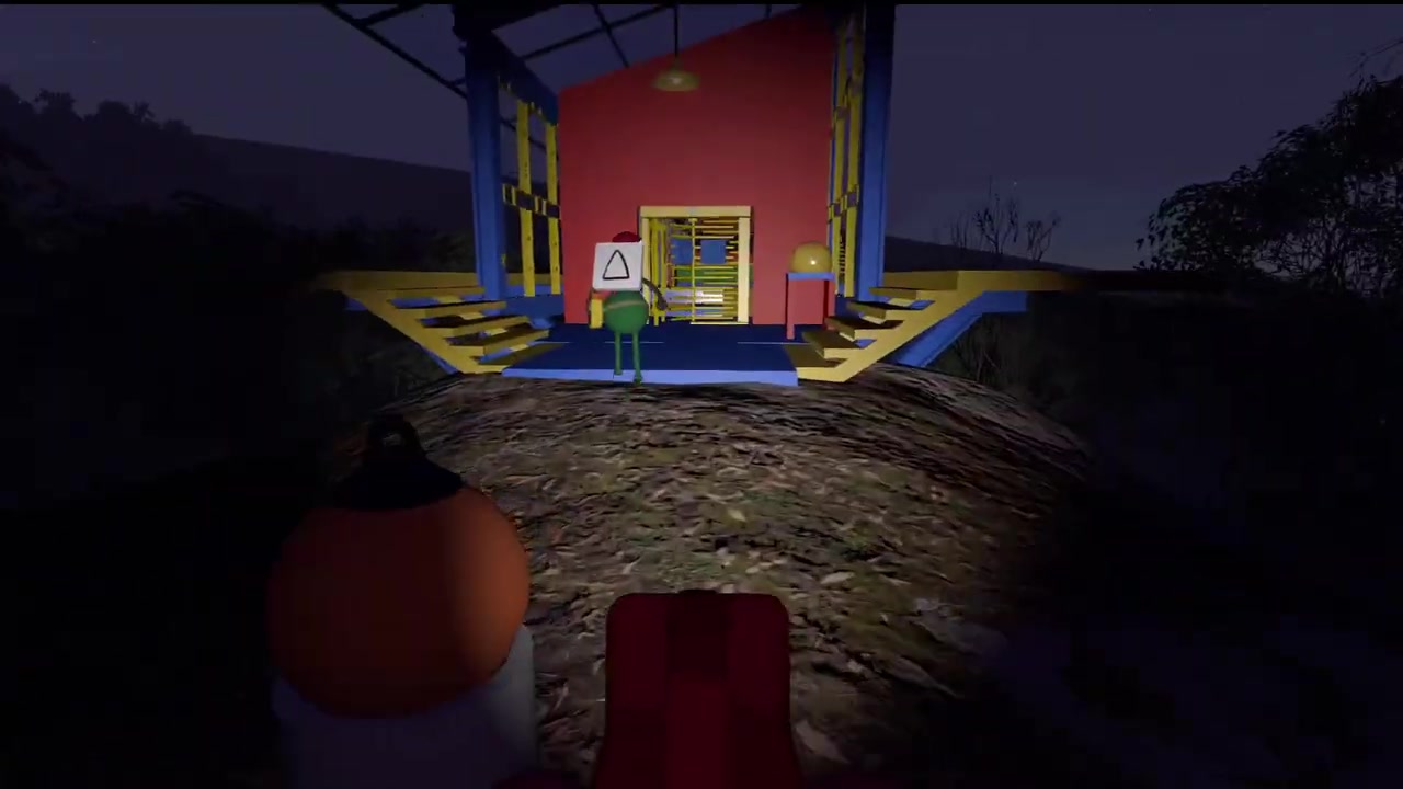 The blue, red, and yellow building that holds the blindfolded obstacle course