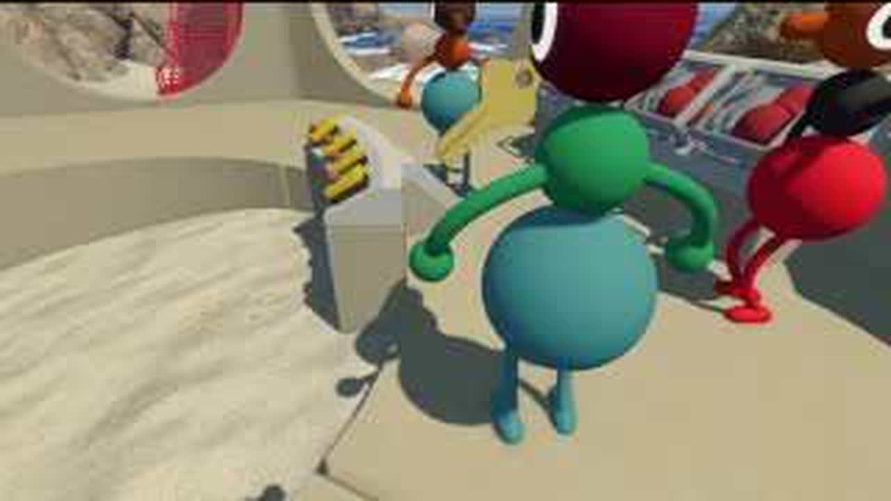 Players placing red figurines into the BIG WALK sand-castle key structure