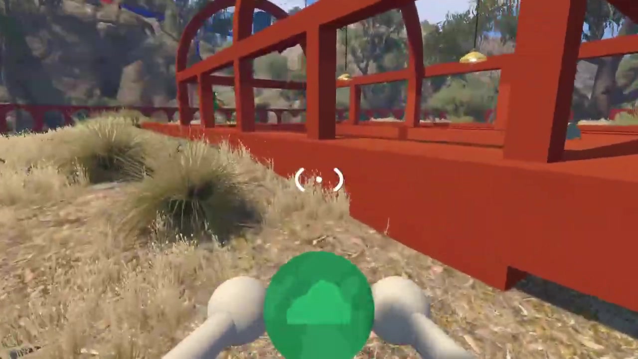 Green four-colour piece carried beside rocks and the raised orange rail
